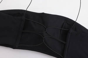 Detail of the thin black shoulder straps and seamless back design of the bralette set
