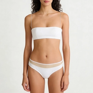 Minimalist white seamless bralette set with thin spaghetti straps and mesh patchwork trim