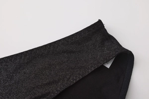 Detail of black glitter fabric panties with a soft cotton crotch and size M label
