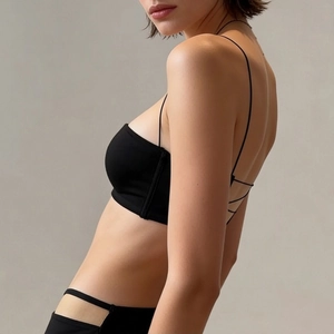 Minimalist black seamless lingerie set with thin straps and criss-cross back detail