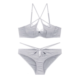 Detail view of grey satin lingerie set with intricate eyelash lace and crisscross straps
