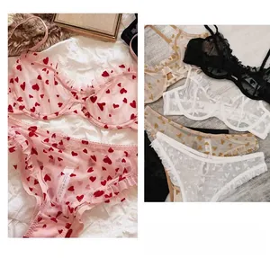 Close-up of sheer mesh lingerie set with sweet heart print and delicate lace ruffles
