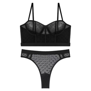 Close-up of black sheer mesh bra set featuring polka dot texture and underwire support