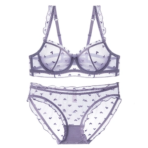 Lacy lavender mesh lingerie set with heart patterns and ruffle details on white background