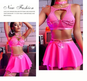 Macro detail of pink faux leather two-piece set with metal rings and heart neckline