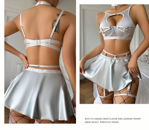 Close-up of metallic silver lace lingerie set with halter top and pleated mini skirt