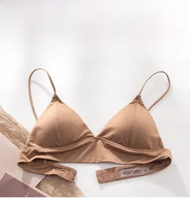Detail of thin shoulder straps and silky coffee-colored lace-free triangular bra