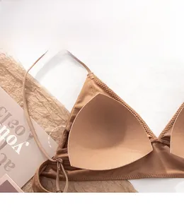 Close-up of removable triangle pads and opening detail on a seamless wireless bra