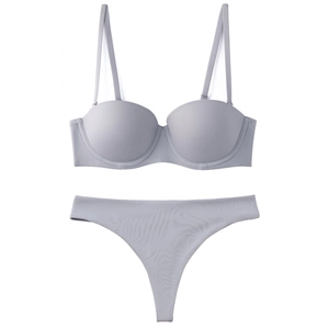 Detailed view of seamless light grey lingerie set featuring 1/2 cup bra and matching thong