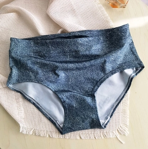 Detail of high waisted seamless panties featuring thick absorbent grey inner lining
