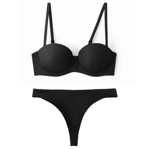 Seamless black push-up lingerie set with half-cup padded bra and matching thong