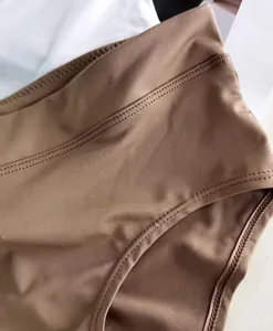 Macro shot of seamless high waist panties in soft breathable fabric with fine stitching