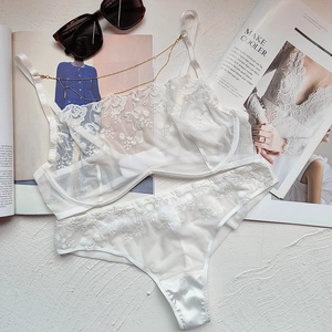 Exquisite white French lace lingerie set with floral embroidery and sheer mesh texture