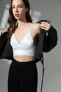 French style white satin triangle bralette styled with a black leather jacket