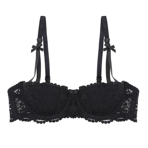 Detail of black floral lace bra with elegant bow accents and underwire support