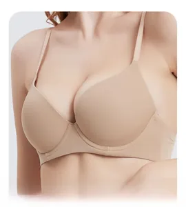 Detail of skin-colored seamless bra featuring thin straps and smooth fabric texture