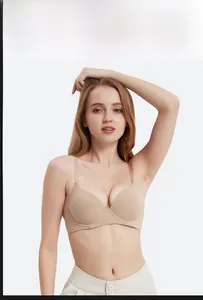 Detailed view of seamless beige bra with slim straps for a natural lifting look
