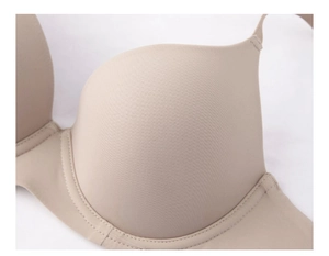 Close-up of seamless nude bra showing smooth fabric texture and fine stitching details