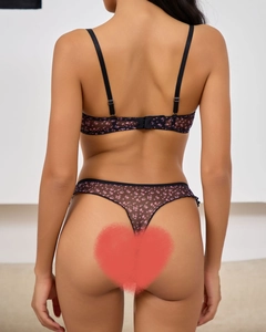Back view of black floral lace lingerie set featuring adjustable straps and mesh thong