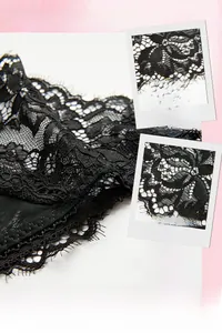 Détail macro de la dentelle cil noire ultra-fine de 2mm et de sa texture respirante