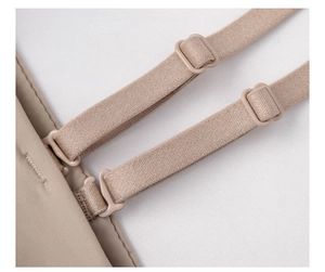 Detailed close-up of adjustable elastic shoulder straps on a seamless beige bra