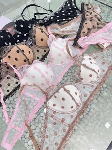 Detailed view of various polka dot lace bras featuring breathable mesh and floral embroidery
