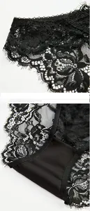 Détail de la dentelle cil noire et de la broderie florale fine sur la culotte de luxe