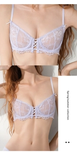 Detail of light purple lace bra showing floral embroidery and ribbon bow on straps