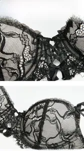 Detailed view of black lace bra with floral embroidery and criss-cross strappy chest detail