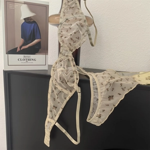 Close-up of floral lace lingerie set in mesh fabric with delicate flower patterns