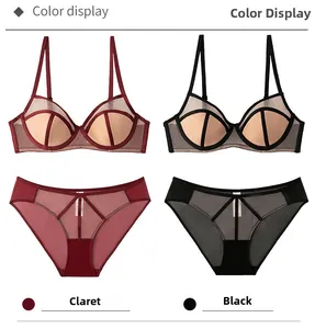 Detail view of sheer mesh lingerie set with geometric contrast stitching in claret and black