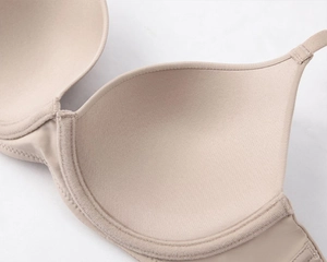 Macro detail of the smooth inner fabric and seamless edge of this nude lace-free bra