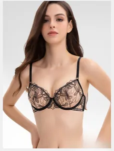 Detailed view of sheer black floral lace embroidery on ultra-thin wireless plunge bra