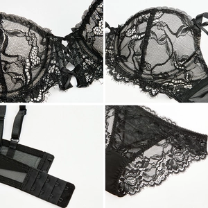 Elegant black lace lingerie set with floral cups and adjustable straps on white background