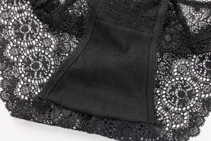 Close-up of black floral lace fabric with breathable mesh and fine stitching details