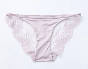 Detail of light purple low-waist briefs with intricate floral lace and mesh textures
