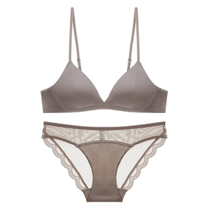 Flat lay of brown wireless triangle bralette with matching lace satin panties