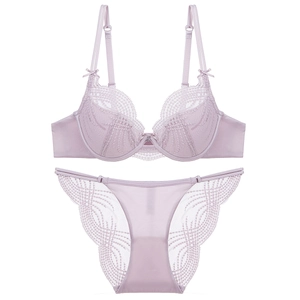 Elegant lavender lace lingerie set for women featuring floral textures and delicate bow detail