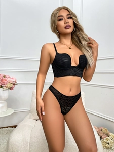 Detail view of black leopard print lingerie set with U-neck bra and matching thong