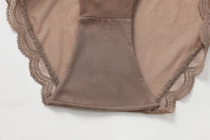 Close-up of seamless lace edging and breathable mesh fabric on low-rise panties