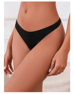 Detail of black seamless V-cut bikini underwear showing smooth breathable fabric on model