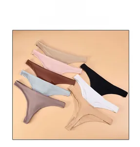 Flat lay of low-rise seamless thongs in seven colors including beige, pink, and black