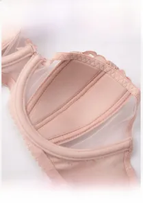 Detail of bunny ear shaped inner cups and breathable lace mesh on skin-pink bra