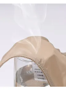Breathability test on skin-colored seamless fabric with steam showing high air permeability