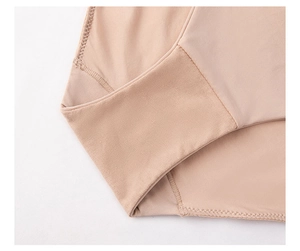 Detail of nude seamless lingerie showing reinforced stitching and wide elastic band