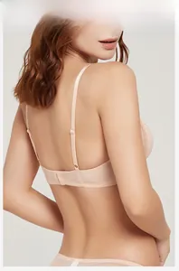 Detailed back view of a beige seamless U-back bra with delicate lace and thin straps