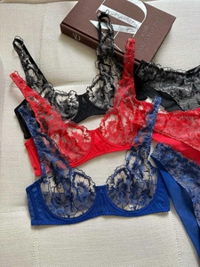 Detailed embroidery on sheer lace lingerie sets in black, red, and sapphire blue