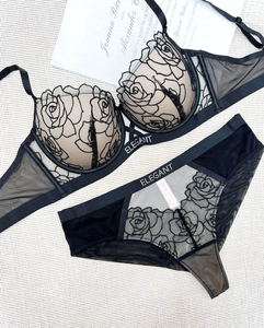 Detail of rose floral embroidery on black lace lingerie set with Elegant letter strap