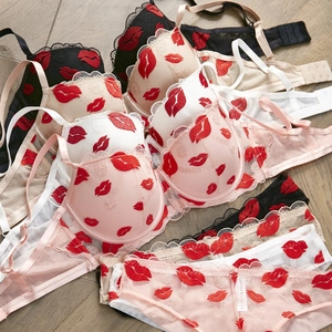 French sexy lingerie set with red lip embroidery, lace details, and multiple colors