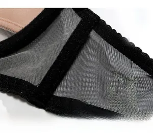 Detailed close-up of high side wings and flexible boning on black lace mesh bra